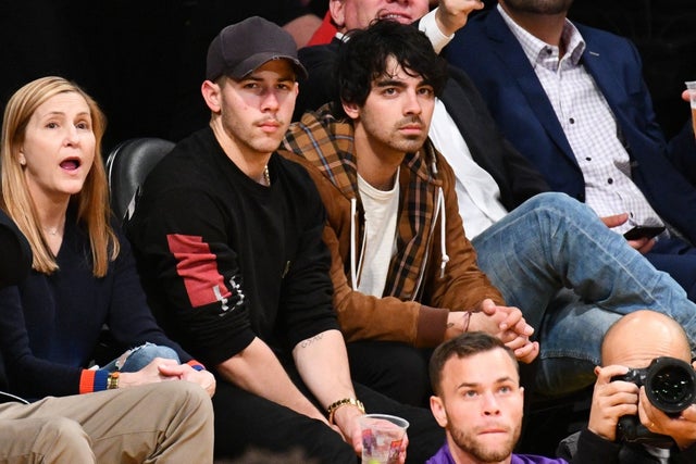 Nick Jonas and Joe Jonas at Lakers game