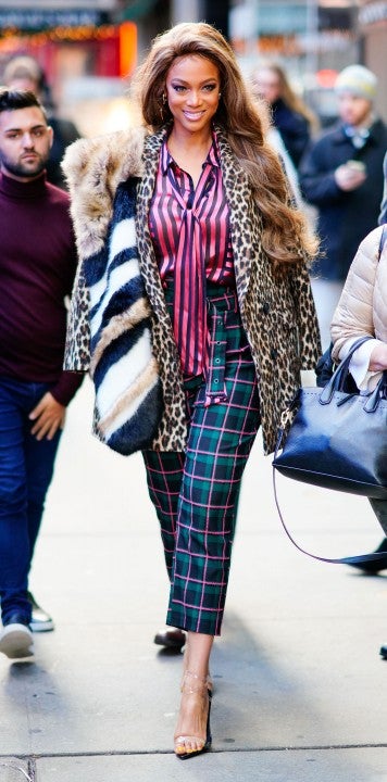 Tyra Banks wearing four bold prints in NYC