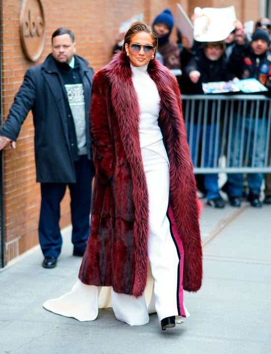 Jennifer Lopez in burgundy fur coat