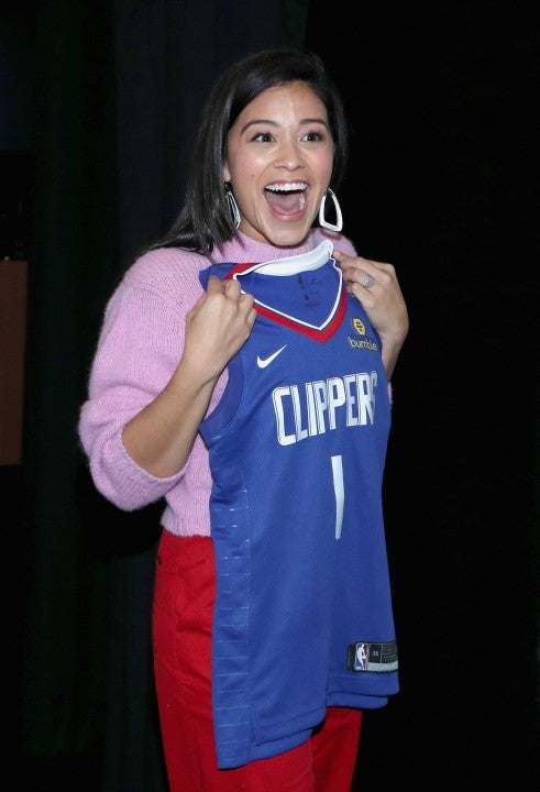 Gina Rodriguez with Clippers jersey at Ford event