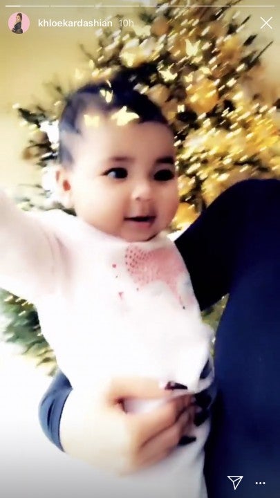 Khloe Kardashian's daughter True in front of xmas tree