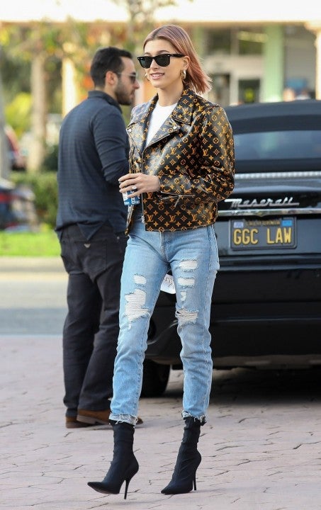 Hailey Baldwin wears Louis Vuitton leather jacket while getting coffee in Brentwood