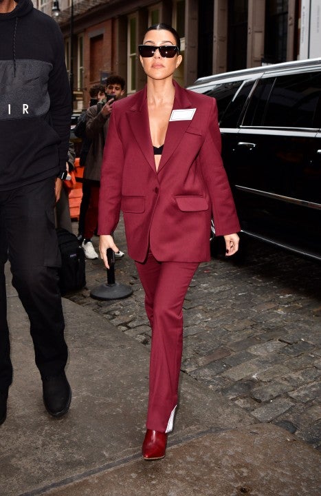 Kourtney Kardashian in maroon suit in nyc