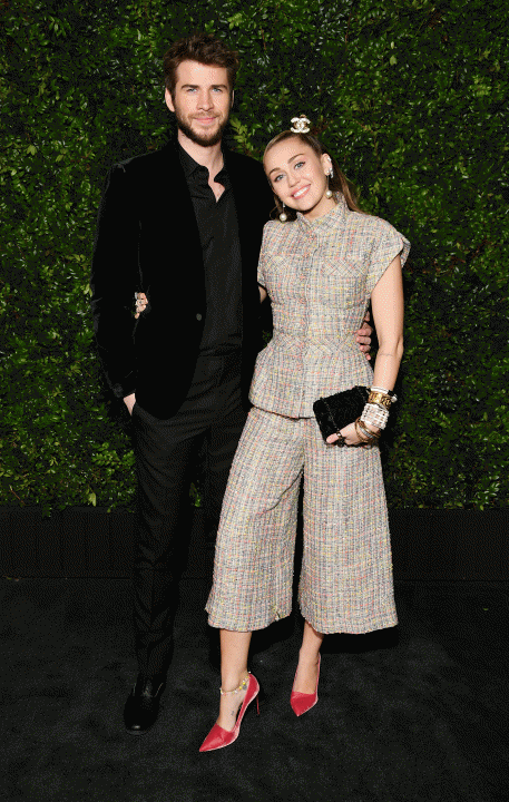 Liam Hemsworth and Miley Cyrus at Chanel and Charles Finch Pre-Oscar Awards Dinner