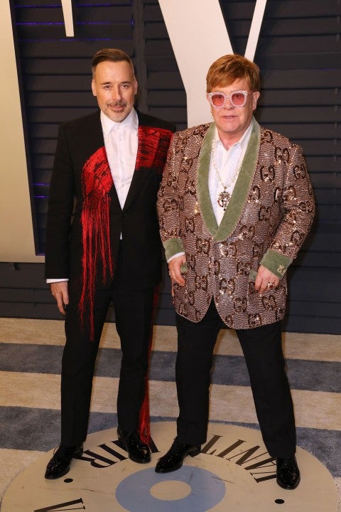 David Furnish and Sir Elton John at vf party