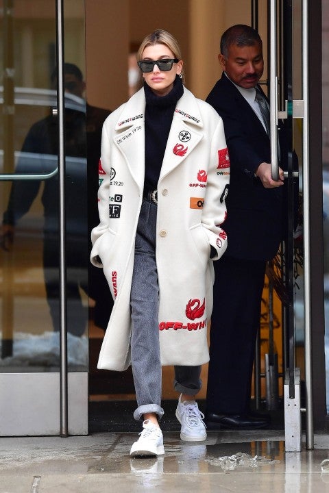 Hailey Baldwin in nyc in printed off-white coat