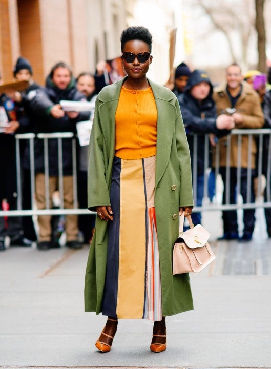 Lupita Nyong'o in NYC in yellow and green outfit