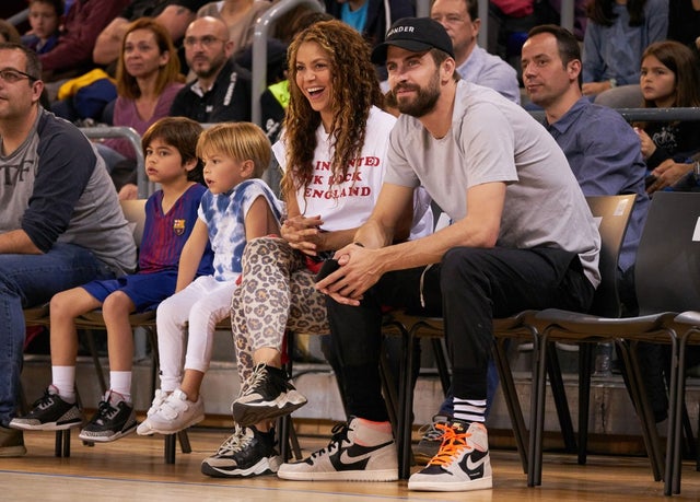 Shakira at bball game with family in barcelona