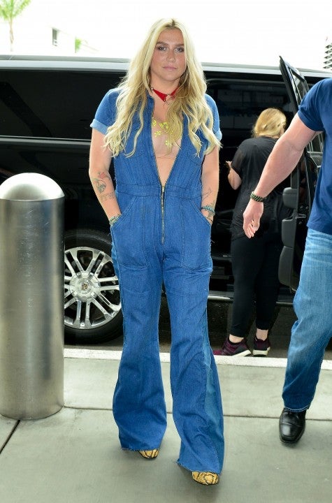 Kesha in denim jumpsuit at lax