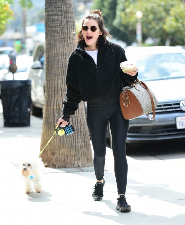 Lucy Hale walks her dog in LA