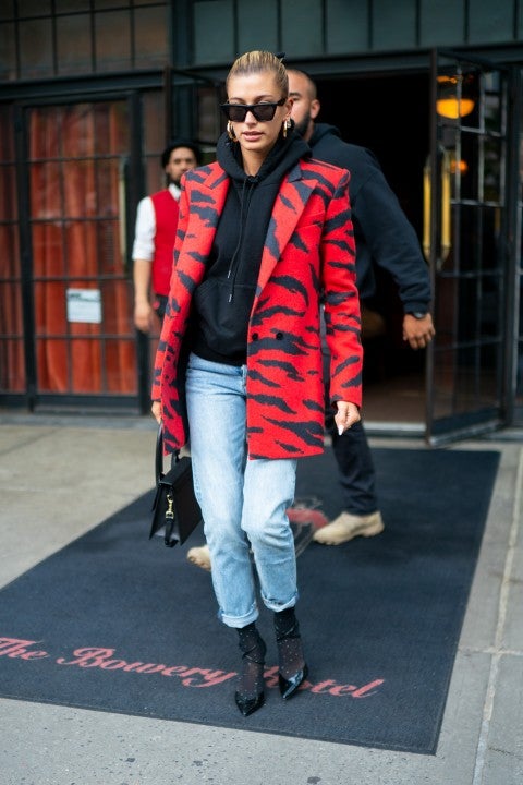Hailey Bieber in red zebra print jacket in nyc