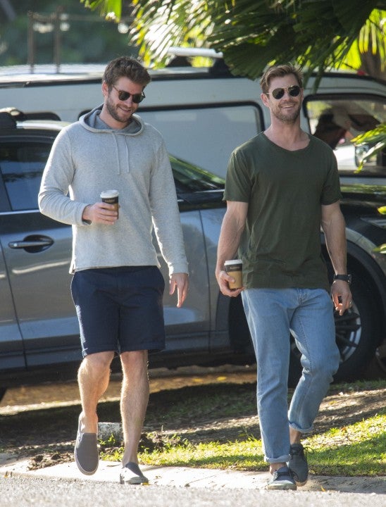 Liam Hemsworth and Chris Hemsworth in Byron Bay