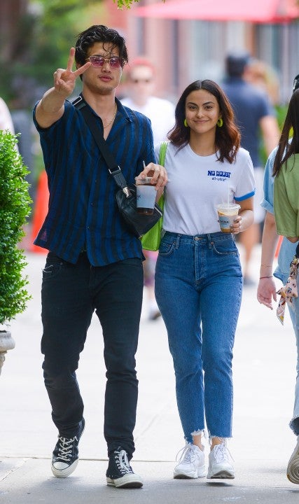 Camila Mendes and Charles Melton hold hands while out and about in New York City on june 24