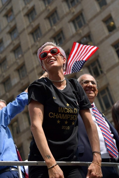 Megan Rapinoe celebrates while riding on a float during The U.S. Women's National Soccer Team Victory Parade down the Canyon of Heroes