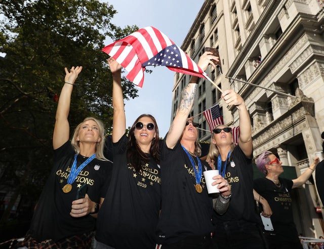 Julie Ertz, Alex Morgan, Ashlyn Harris, and Allie Long celebrate during the U.S. Women's National Soccer Team Victory Parade