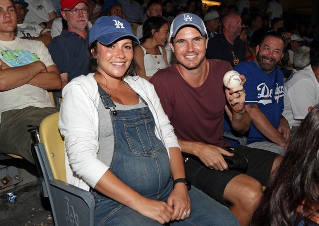 Robbie Amell and Italia Ricci at dodgers game