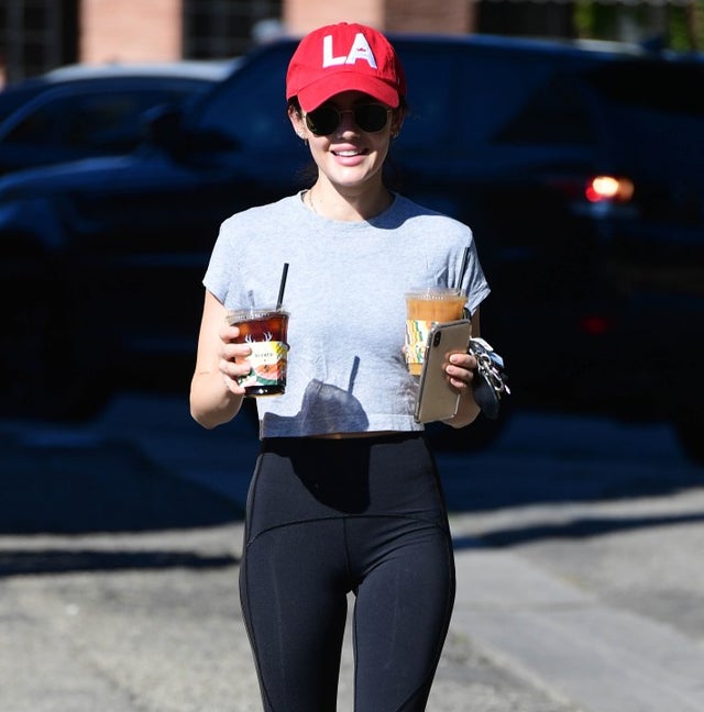 lucy hale in LA cap with two coffees