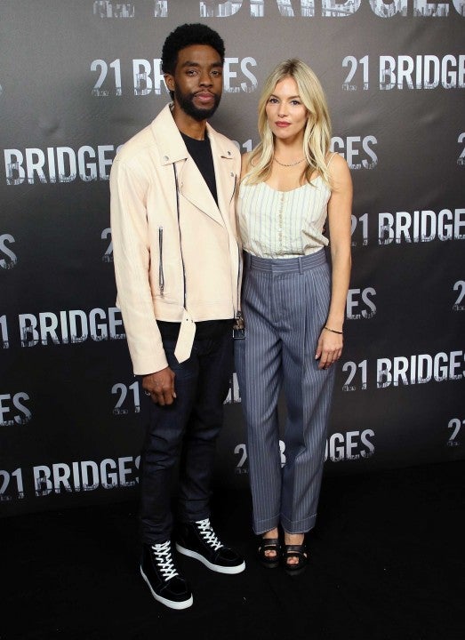 Chadwick Boseman and Sienna Miller at a photocall for STX Entertainment's "21 Bridges" 
