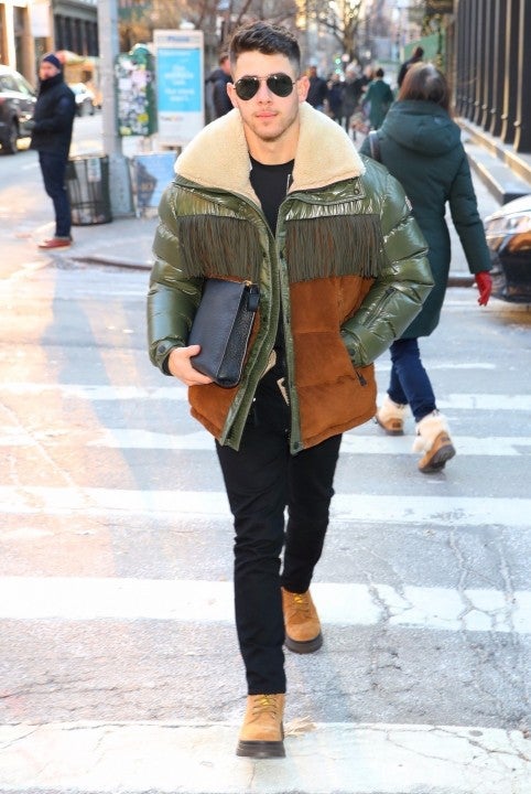 nick jonas in puffy jacket in nyc