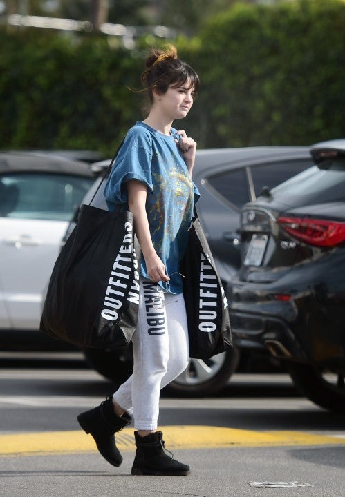 selena gomez with urban outfitters bags in la