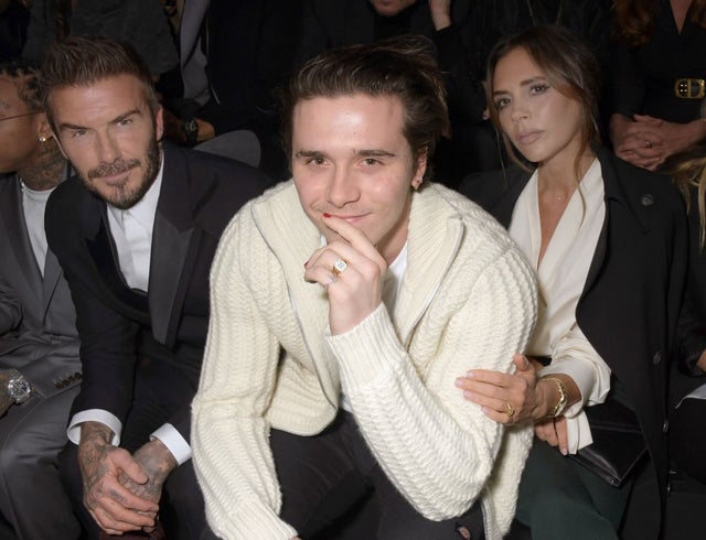 David, Brooklyn and Victoria Beckham at paris fashion week