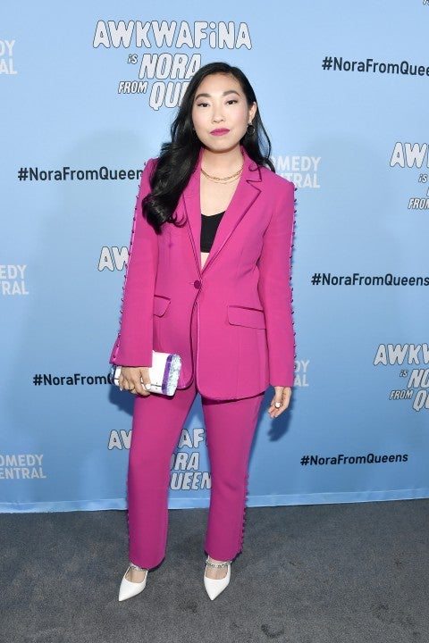 Awkwafina in neon pink suit