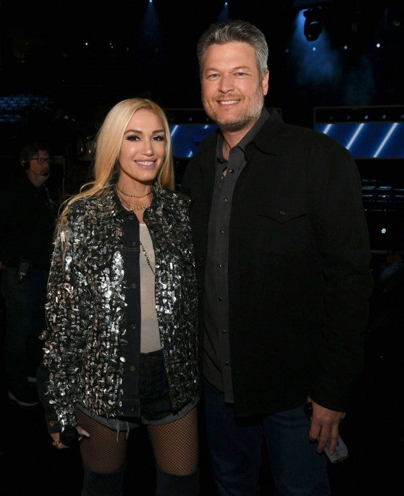 Gwen Stefani and Blake Shelton pose in the audience during the 62nd Annual GRAMMY Awards rehearsal