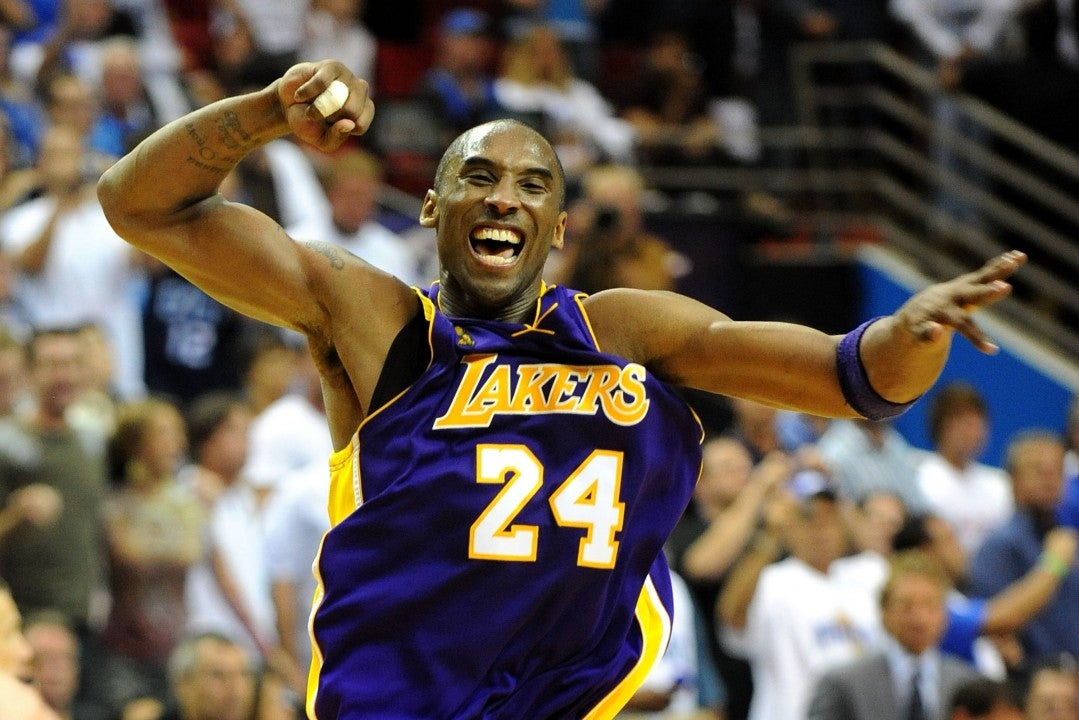 Kobe Bryant June 12, 2002 - Los Angeles Kobe Bryant holds the NBA championship  trophy in the