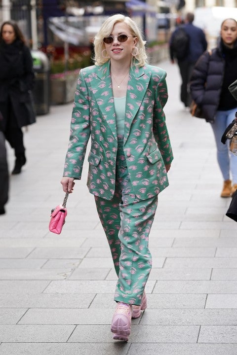 Carly Rae Jepsen in green and pink suit in London