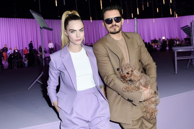 Cara Delevingne and Orlando Bloom with his dog Mighty at the Boss fashion show in italy