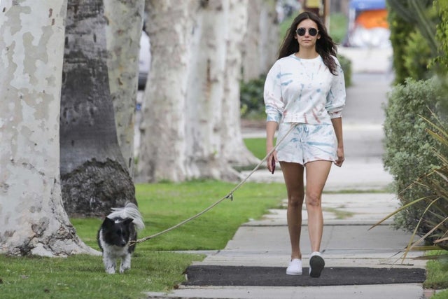Nina Dobrev walks dog in tie-dye