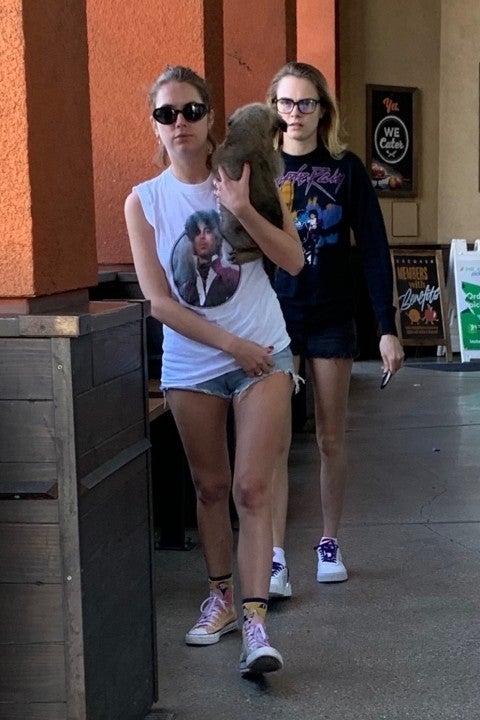 Ashley Benson and Cara Delevingne at erewhon with foster dog