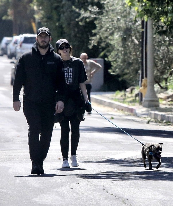Chris Pratt and Katherine Schwarzenegger walk their dog through their Brentwood neighborhood on March 29.