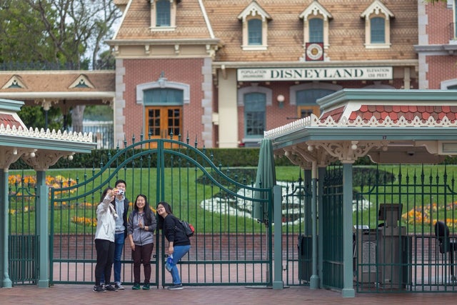 Disneyland and Disney California Adventure gates with tourists