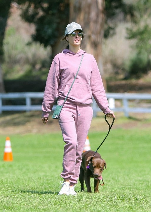 Alessandra Ambrosio is seen taking her dog, Cinnamon for a walk