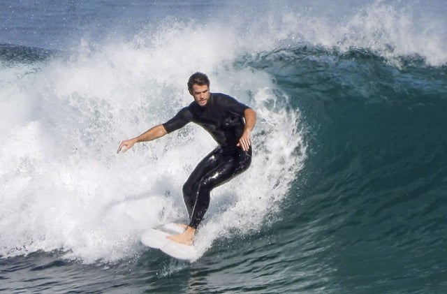 liam hemsworth surfs in australia on 3/29