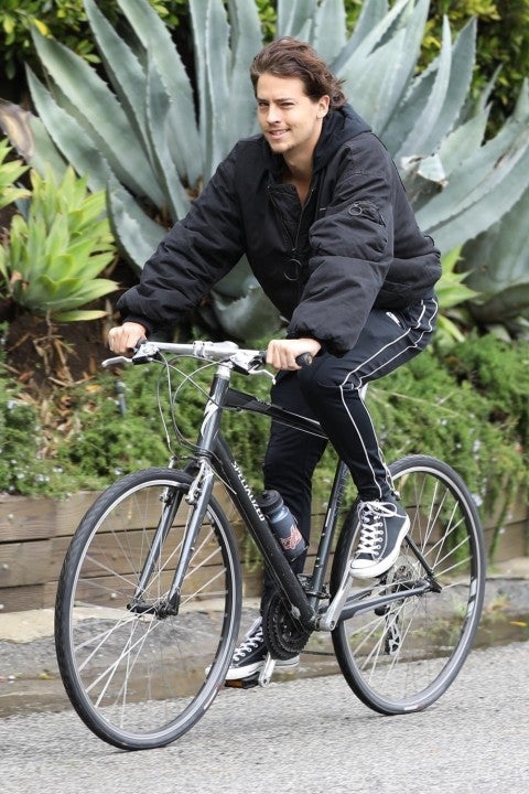 Cole Sprouse on bike in hollywood hills