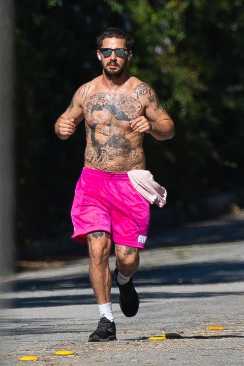 shia labeouf runs in pink shorts