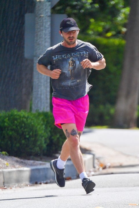 Shia LaBeouf running in pink shorts