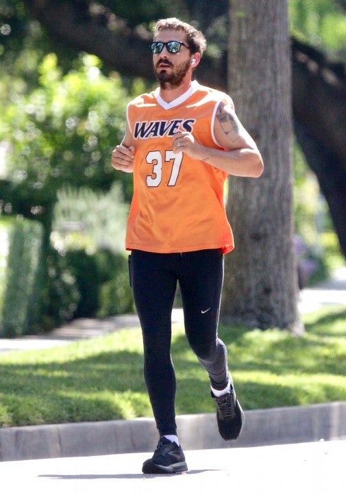 shia labeouf running in orange jersey