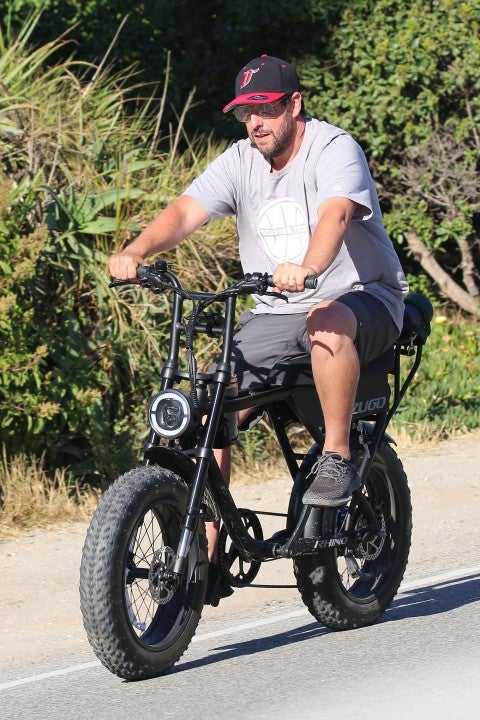 Adam Sandler on bike