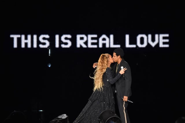 Beyonce and Jay-Z kiss ending their performance on stage during the "On the Run II" Tour in scotland