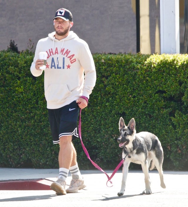 Colton Underwood walks his dog