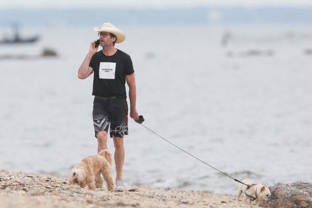 Hugh Jackman with dogs on beach