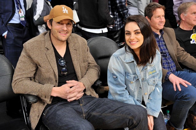 Ashton Kutcher and Mila Kunis at a basketball game between the Los Angeles Lakers and the Philadelphia 76ers
