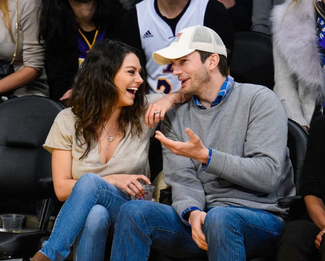 mila kunis and ashton kutcher at lakers game in 2014