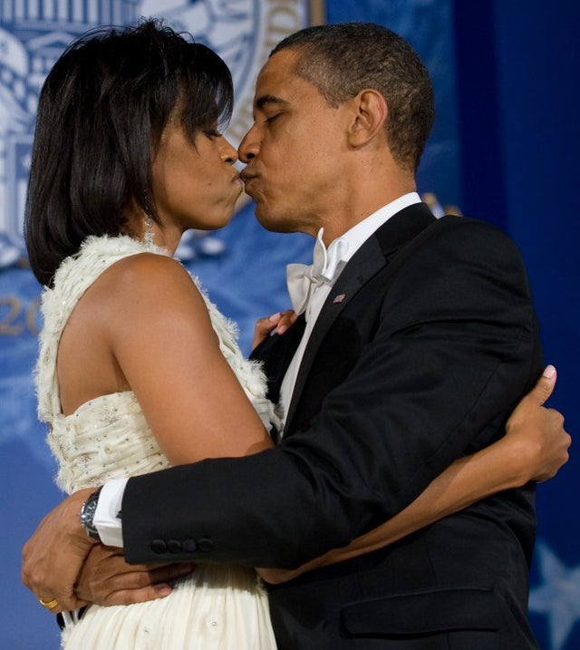 Barack Obama and Michelle Obama kiss during the Eastern Regional Inaugural Ball 2009