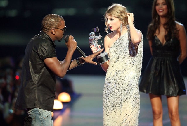 Kanye West jumps onstage after Taylor Swift won the "Best Female Video" at 2009 mtv vmas