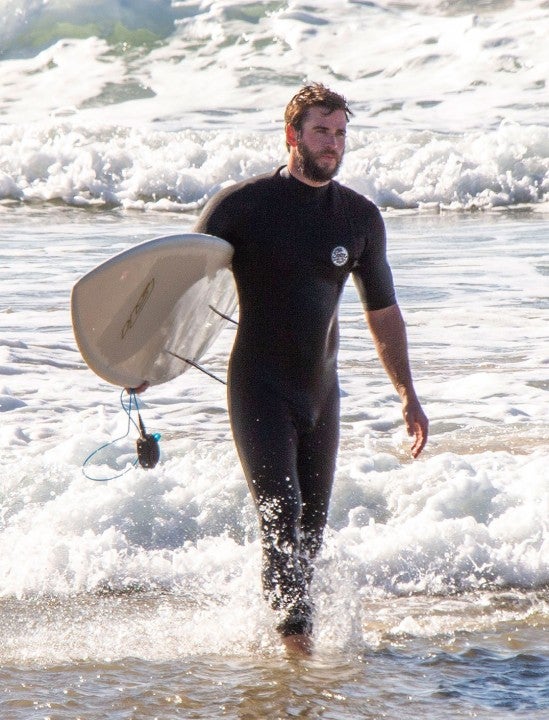 Liam Hemsworth surfing in byron bay