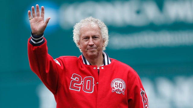 Don Sutton #20 waves to the fans as he gets ready to throw out the celebratory first pitch before the game between the Atlanta Braves and the Los Angeles Angels of Anaheim on May 22, 2011 at Angel Stadium in Anaheim, California. 